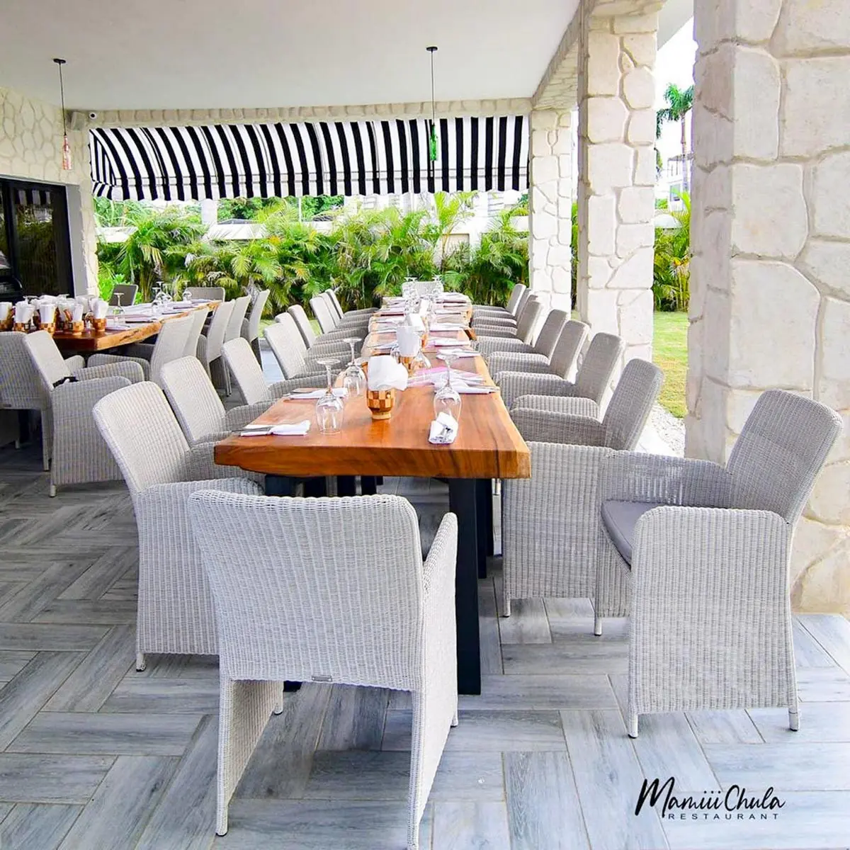 Tables on the terrace at Mamiii Chula Restaurant at Playa Palmera Beach Resort